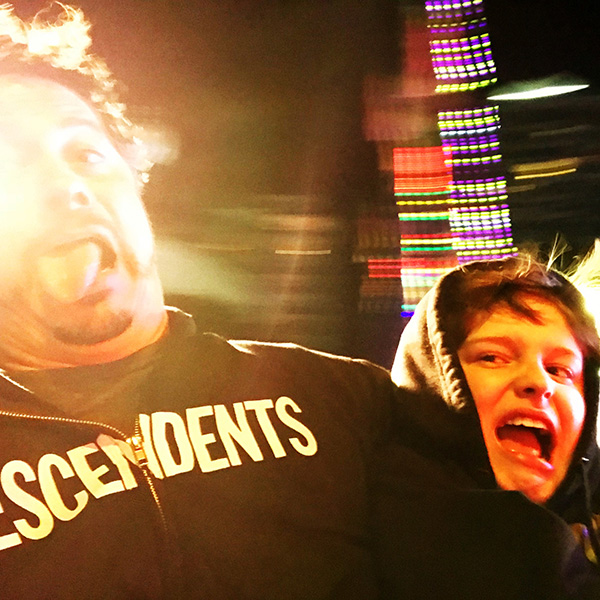 Stepdad and stepson on carnival ride