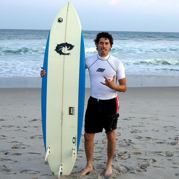 Surfer on beach with board